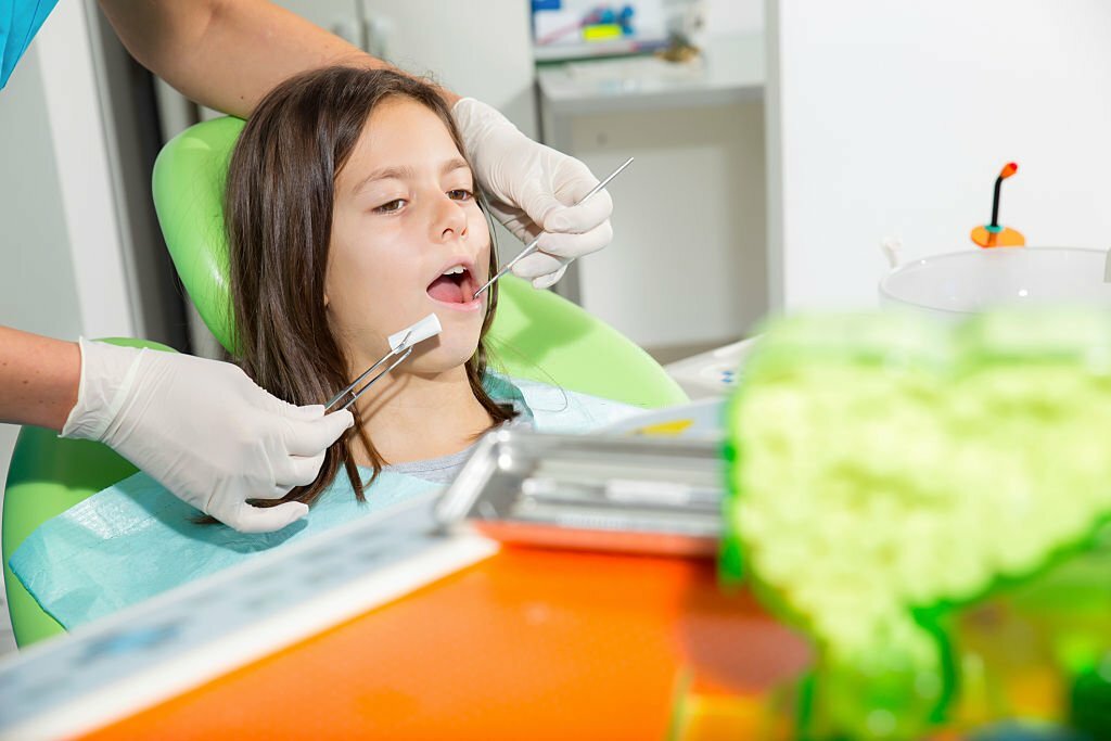 Little girl in dentist office